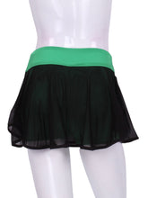 Load image into Gallery viewer, This Black Mesh on Green Shorties and waistband LOVE "O" Skirt has shorties underneath and NO seams on the "O"! It's cut like a doughnut to show and move beautifully as you play. The fabric is uber soft and light - it dries quickly - and protects from UV rays too. The embroidery is Green + Black to match the skirt! A very sheer skirt makes this the lightest and coolest of skirts!