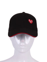 Load image into Gallery viewer, Black Trucker Hat with Heart + Rackets is a unique and eye-catching accessory that beautifully combines sporty aesthetics with a touch of emotion and symbolism.