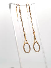 Load image into Gallery viewer, Custom exclusive design by Adeline a very unique pair of earrings. The rackets are 1" long and the earrings sit 2 1/2" down. The racket and hook are solid gold and adorned with many beautiful clear diamonds to make you "shine" on the court. Very strong yet light enough to play in!