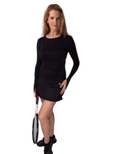 Load image into Gallery viewer, Our "Long Sleeve Monroe Tennis Dress" offers a little more coverage around the chest and arms than our "Monroe Tennis Dress", yet delicately shows your feminine curves. The dress is fitted throughout the body, with a flirty ruffle at the hem.  It's perfect for tennis, and yet elegant enough for drinks after your win.