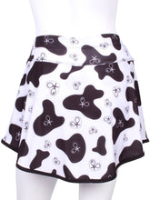 Load image into Gallery viewer, This is our limited edition Gladiator Skirt CowPrint. This piece has a silky soft and quick-drying matching shorties, and binding to match. We make these in very small quantities - by design. Unique. Luxurious. Comfortable. Cool. Fun.