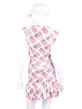 Load image into Gallery viewer, The Monroe Dress delicately shows your feminine curves. It is a fitted dress, until the bottom where there is a cute ruffle. These Hand Pressed American Flags pieces are very limited edition - only one made per size.