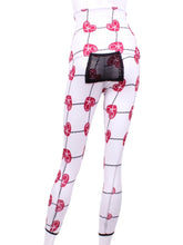 Load image into Gallery viewer, This is our limited edition roll down waist leggings in Raspberry Red Hearts & Net. This piece has a silky soft and quick-drying with a convenient back pocket for your tennis balls. We make these in very small quantities - by design. Unique. Luxurious. Comfortable. Cool. Fun.