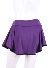 Load image into Gallery viewer, This limited Purple LOVE "O" Skirt has shorties underneath and NO seams on the "O"! It's cut like a doughnut to show and move beautifully as you play. The fabric is uber soft and light - it dries quickly - and protects from UV rays too. This skirt has a “nearly naked” feel about it. The embroidery Heart is Black + Rackets and Ball Purple to match the skirt. Sleek black thread and binding.