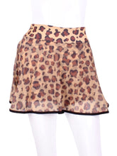 Load image into Gallery viewer, This limited Leopard Mesh LOVE "O" Skirt has shorties underneath and NO seams on the "O"! It's cut like a doughnut to show and move beautifully as you play. The fabric is uber soft and light - it dries quickly - and protects from UV rays too. This skirt has a “nearly naked” feel about it. Sleek black thread and binding.