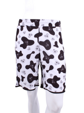 Load image into Gallery viewer, This is our limited edition Short Men’s Shorts in Cow Print. This piece has a silky and soft fabric. We make these in very small quantities - by design. Unique. Luxurious. Comfortable. Cool. Fun.