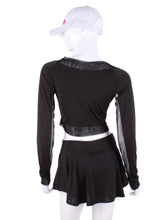 Load image into Gallery viewer, Black Vee Crop Top With Mesh. This vee neckline tops arm protection from the sun, but have mesh under the arm to keep you COOL while you play. Designed very short to allow for access to the back pocket on my court to cocktails tennis dresses.