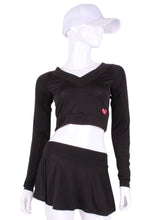 Load image into Gallery viewer, Black Vee Crop Top. This vee neckline tops arm protection from the sun, but have mesh under the arm to keep you COOL while you play. Designed very short to allow for access to the back pocket on my court to cocktails tennis dresses.