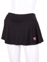 Load image into Gallery viewer, This limited Black LOVE "O" Skirt has shorties underneath and NO seams on the "O"! It's cut like a doughnut to show and move beautifully as you play. The fabric is uber soft and light - it dries quickly - and protects from UV rays too. This skirt has a “nearly naked” feel about it. The embroidery Heart is Red + Rackets and Ball Black to match the mesh. Sleek black thread on the binding.