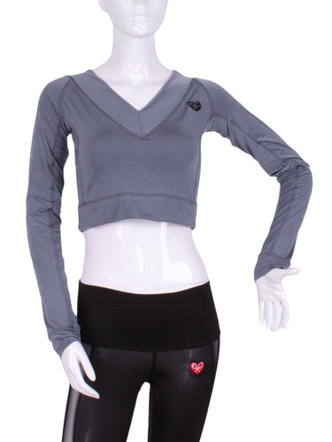 This vee neckline tops arm protection from the sun, but have mesh under the arm to keep you COOL while you play.  These are the grey collection with airy black mesh contrast.  Designed very short to allow for access to the back pocket on my court to cocktails tennis dresses.