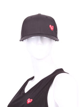 Load image into Gallery viewer, Black Hat + Red Heart &amp; Holey Back with the &quot;Love Love Tennis&quot; Heart and holey back is a stylish and functional accessory designed for tennis enthusiasts who want to combine fashion with functionality on the court. The hat is primarily black, which gives it a sleek and versatile appearance, making it suitable for various tennis outfits. At the front of the hat, prominently displayed, is the &quot;Love Love Tennis&quot; Heart logo. 
