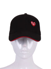 Load image into Gallery viewer, Black Trucker Hat with Heart + Rackets is a unique and eye-catching accessory that beautifully combines sporty aesthetics with a touch of emotion and symbolism.
