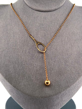 Load image into Gallery viewer, The newest design by Adeline - this unusual necklace is a tennis lovers delight.   The solid gold ball threads through the racket and can be worn higher or lower on the neck.  This piece was hand made in the jewelry district of Los Angeles by a fine jewel craft team.  The racket is 1&quot; long and the ball is 6mm around.  Light yet strong enough to play (and win) in.
