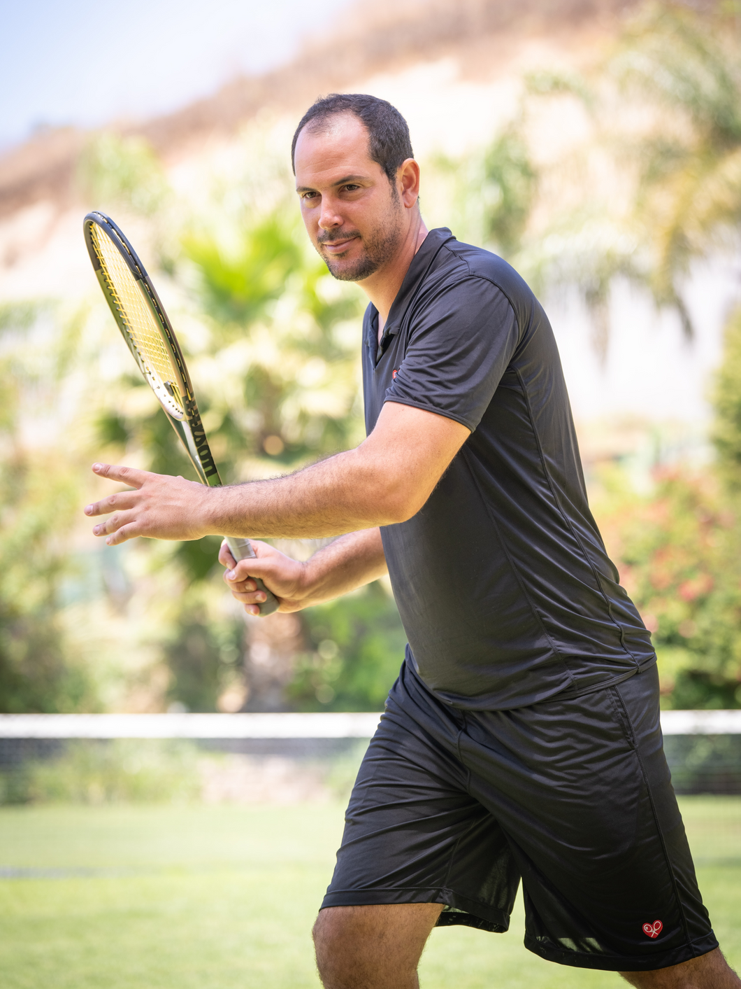 The Short Tennis Men's Polo Shirt in Black is a remarkable piece of clothing that exudes both style and comfort. Crafted with meticulous attention to detail, this polo shirt is designed to elevate your wardrobe with its sophisticated charm.