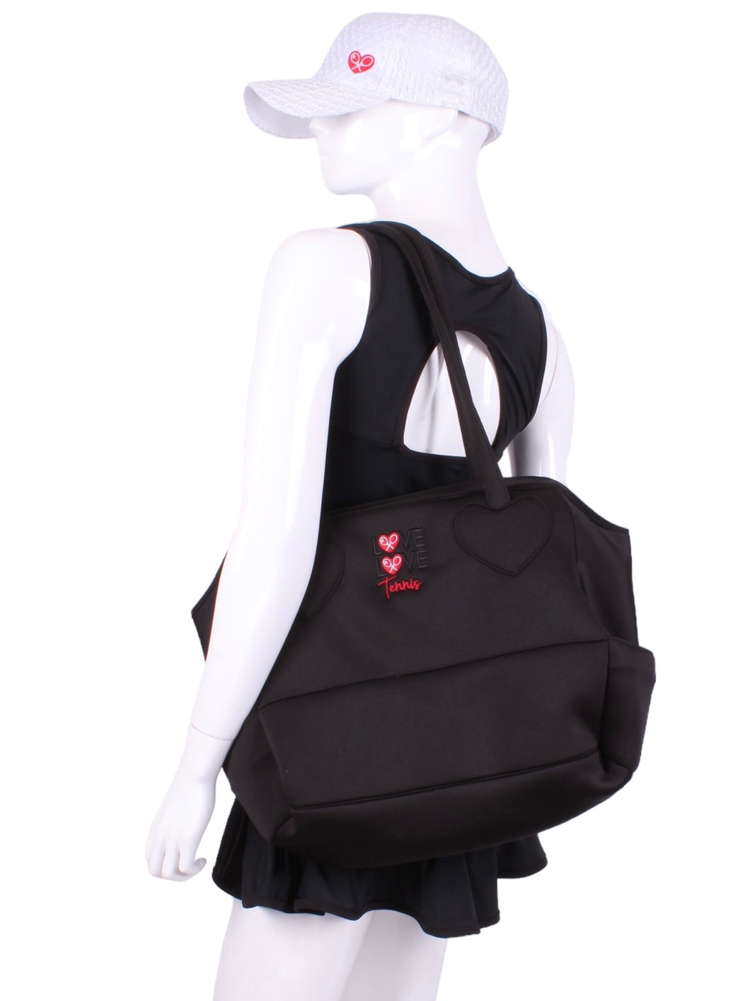 Our soft black mini tote tennis bag is a stylish and functional accessory designed specifically for tennis enthusiasts. It is a smaller-sized bag, ideal for carrying essential items to the tennis court while maintaining a sleek and modern look. The bag is made from high-quality soft black fabric, which is durable and easy to clean. The material gives the bag a luxurious feel and ensures it can withstand the rigors of regular use. 