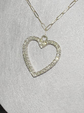 Load and play video in Gallery viewer, This luxurious necklace features a 1 inch gold heart covered in diamonds totalling over 1 karat. Displays beautifully on an elegant solid gold paper clip chain. By LOVE LOVE TENNIS
