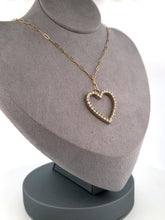 Load and play video in Gallery viewer, This luxurious necklace features a 1 inch gold heart covered in diamonds totalling over 1 karat. Displays beautifully on an elegant solid gold paper clip chain. By LOVE LOVE TENNIS
