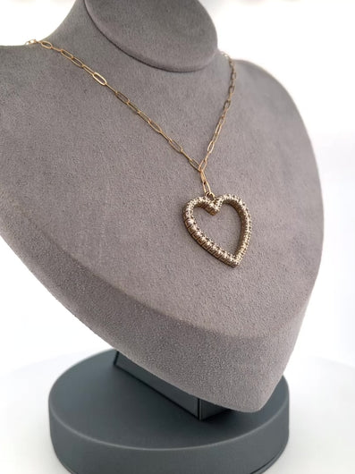 This luxurious necklace features a 1 inch gold heart covered in diamonds totalling over 1 karat. Displays beautifully on an elegant solid gold paper clip chain. By LOVE LOVE TENNIS