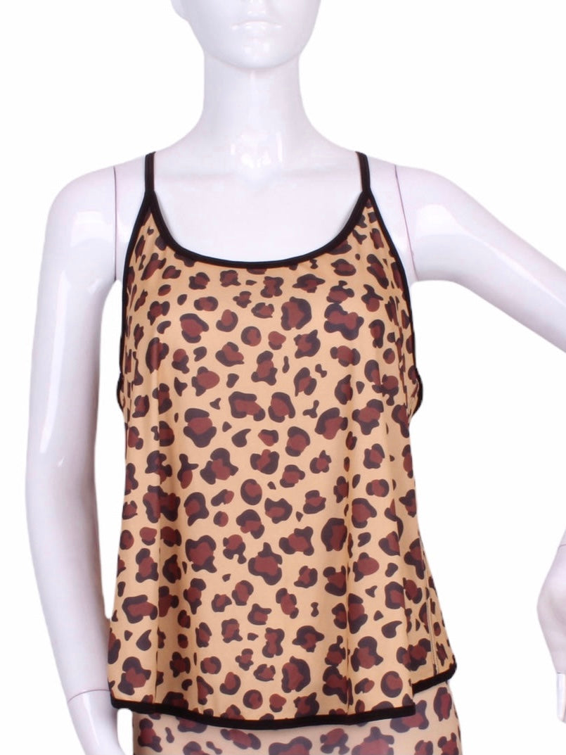 A cool and flowy Baggy Tank tennis top for ultimate comfort.  A deep scoop neckline front and strappy high back with two-needle cover stitch at each seam.   Smooth black binding finishes the edges.