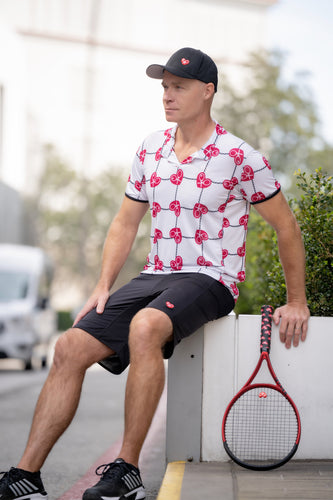 This is our limited edition Men’s Polo with Rasp Red Hearts and Net.   This piece has a silky and soft fabric.   We make these in very small quantities - by design.  Unique.  Luxurious.  Comfortable.  Cool.  Fun.