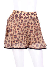 Load image into Gallery viewer, This limited Leopard Mesh LOVE &quot;O&quot; Skirt has shorties underneath and NO seams on the &quot;O&quot;!  It&#39;s cut like a doughnut to show and move beautifully as you play.  The fabric is uber soft and light - it dries quickly - and protects from UV rays too.  This skirt has a “nearly naked” feel about it.   Sleek black thread and binding.
