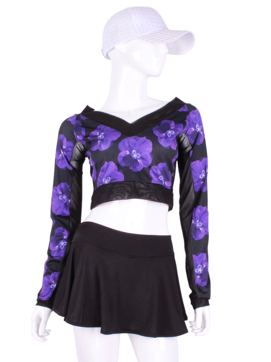 This vee neckline tops arm protection from the sun, but have mesh under the arm to keep you COOL while you play.  Designed very short to allow for access to the back pocket on my court to cocktails tennis dresses.  Handmade in Los Angeles.