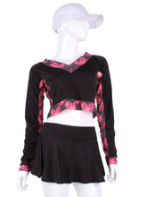 Load image into Gallery viewer, Black Vee Crop Top with Heart Mesh Trim. This vee neckline tops arm protection from the sun, but have mesh under the arm to keep you COOL while you play.  These beautiful tops have the Heart + Rackets (trademarked) logo as the contrast.  Designed very short to allow for access to the back pocket on my court to cocktails tennis dresses.  Hand sewn in Los Angeles.
