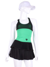 Load image into Gallery viewer, Ruffle Tank Tennis Top Green &amp; Black Mesh. An elegant tennis ruffle top - silky soft - light - and quick-drying breathable fabric.   Scoop neckline front and crossed back with two-needle cover stitch at each seam.   Smooth binding finishes the edges with class.  The most comfortable and feminine tennis top.  These pieces run small for a more petite woman - under 5’8” - for the medium max 34 D
