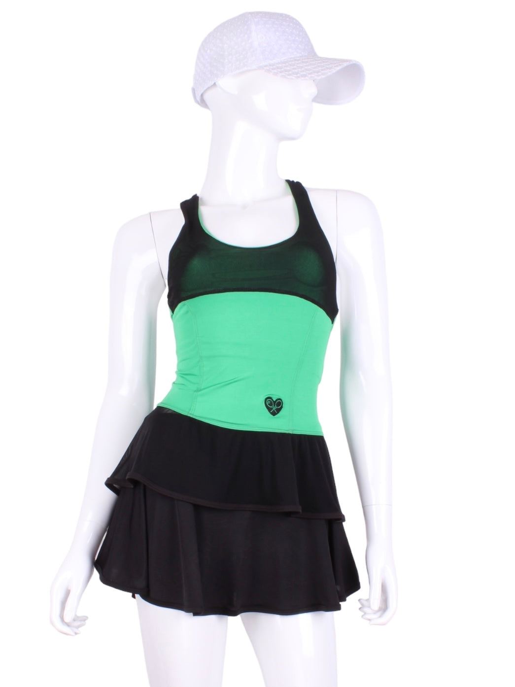 Ruffle Tank Tennis Top Green & Black Mesh. An elegant tennis ruffle top - silky soft - light - and quick-drying breathable fabric.   Scoop neckline front and crossed back with two-needle cover stitch at each seam.   Smooth binding finishes the edges with class.  The most comfortable and feminine tennis top.  These pieces run small for a more petite woman - under 5’8” - for the medium max 34 D