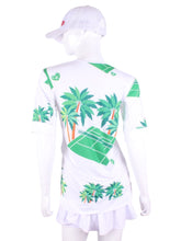 Load image into Gallery viewer,  Palm Trees + Court Baggy Vee Tee. The very comfortable Baggy Vee Tee is so cool and easy to wear.  For the lady that likes a little room when she plays - the feminine top is flowing in the air.  This Palm Trees + Tennis Court on a white background has a white stripe down the sides, hem, collar, and cuff.
