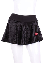 Load image into Gallery viewer, This is our limited edition Crushed Black Velvet LOVE “O” Skirt!  Each Skirt is hand cut in ONE PIECE with no side seams!  It flows as you twirl on the court.  (And we LOVE receiving “slow motion” videos of our clients doing the #tennistwirl on Instagram @ilovemydoublespartner)  This piece has a silky soft and quick drying black waistband, shorties and binding to match.  We make these in very small quantities - by design.  Unique.  Luxurious.  Comfortable.  Cool.  Fun.
